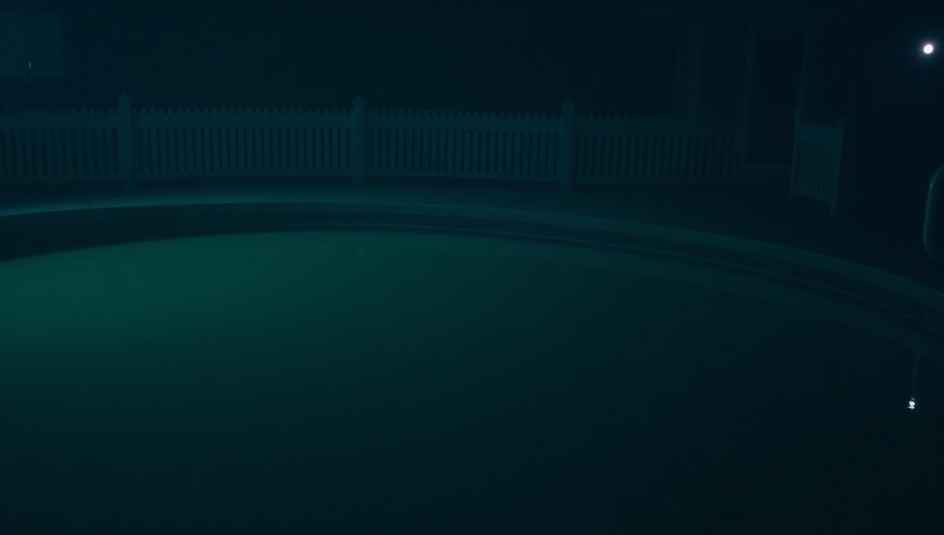 Empty backyard with tape outline of future pool